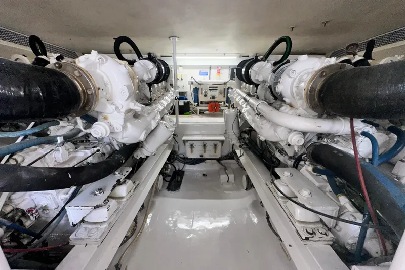 Slide: The Image of Engine room of a 1997 Viking 58 Convertible yacht, showcasing dual engines. - 151