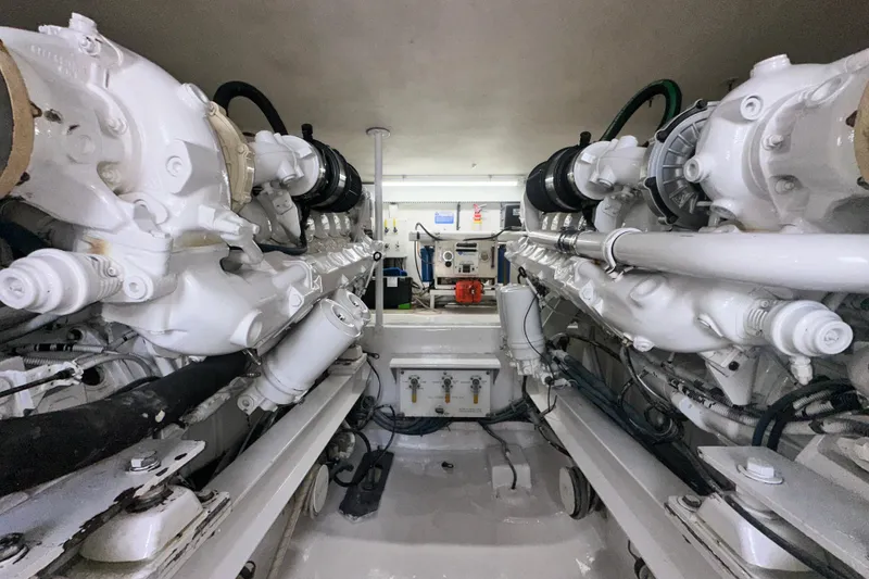 Slide: The Image of Engine room of a 1997 Viking 58 Convertible yacht, showcasing dual engines. - 155