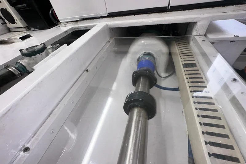 Slide: The Image of Engine room of a 1997 Viking 58 Convertible yacht, showcasing mechanical components. - 157