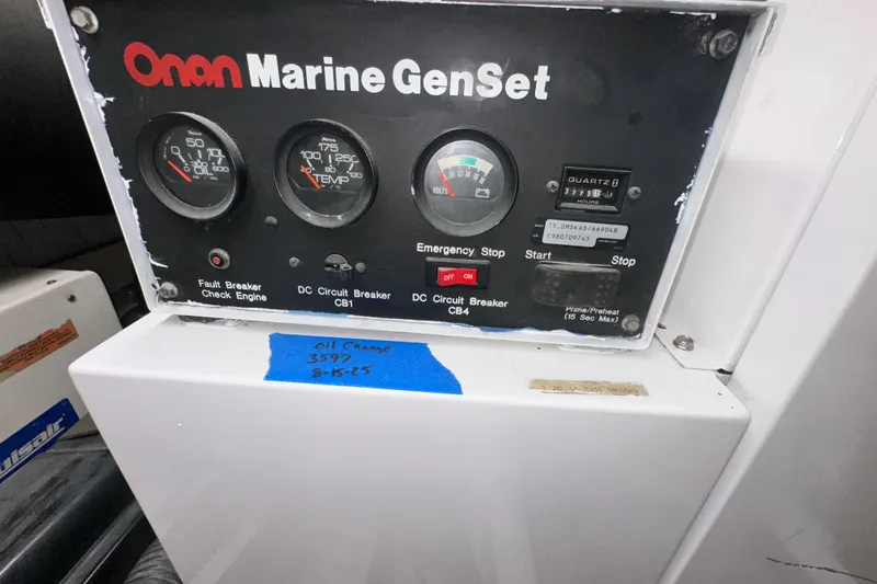Slide: The Image of Onan Marine GenSet control panel on 1997 Viking 58 Convertible boat. - 159