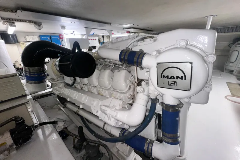 Slide: The Image of Engine room of a 1997 Viking 58 Convertible with MAN engine components. - 163