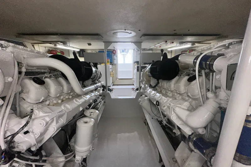 Slide: The Image of Engine room of a 1997 Viking 58 Convertible yacht, showcasing dual engines. - 167