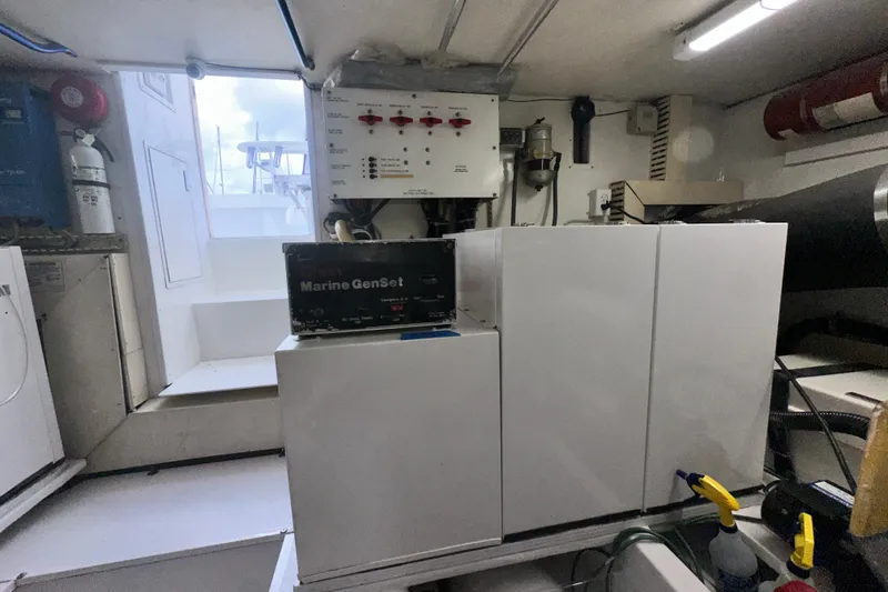 Slide: The Image of Engine room of a 1997 Viking 58 Convertible yacht with Marine GenSet generator. - 168