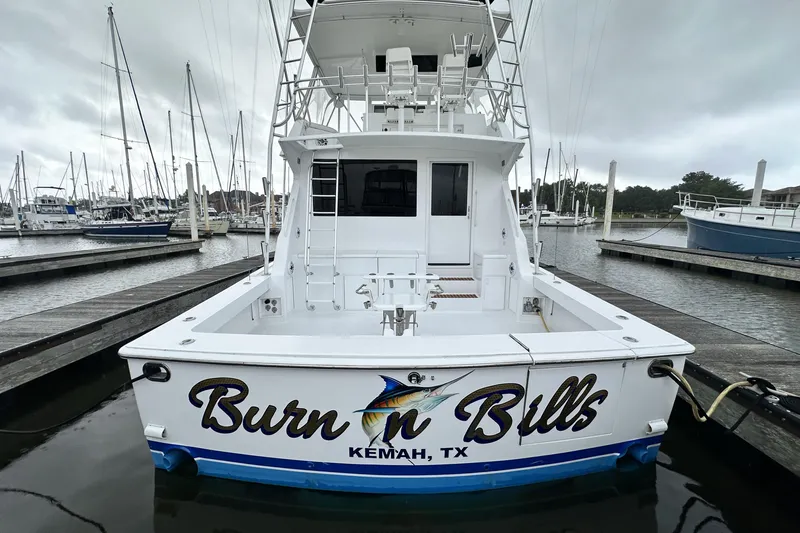 Slide: The Image of 1997 Viking 58 Convertible boat docked, featuring "Burn n Bills" text, Kemah, TX. - 29