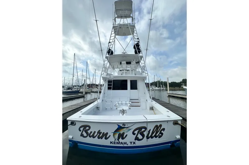 Slide: The Image of 1997 Viking 58 Convertible yacht docked, featuring "Burn 'n Bills" name, Kemah, TX. - 31