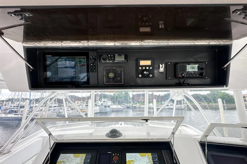 Slide: The Image of Cockpit view of a 1997 Viking 58 Convertible yacht with navigation equipment. - 48