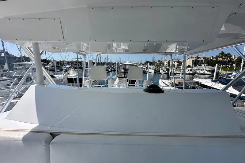 Slide: The Image of 1997 Viking 58 Convertible yacht bridge view in marina setting. - 54