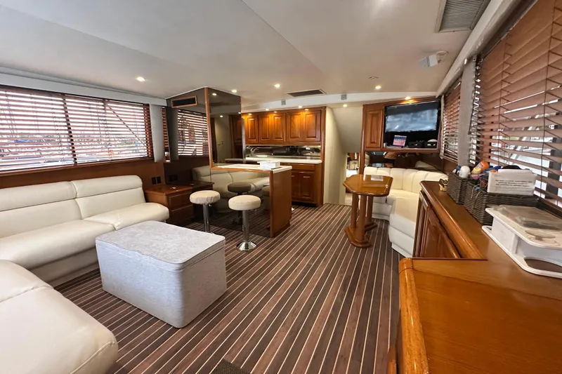 Slide: The Image of Luxurious interior of a 1997 Viking 58 Convertible yacht with elegant wood finishes. - 57