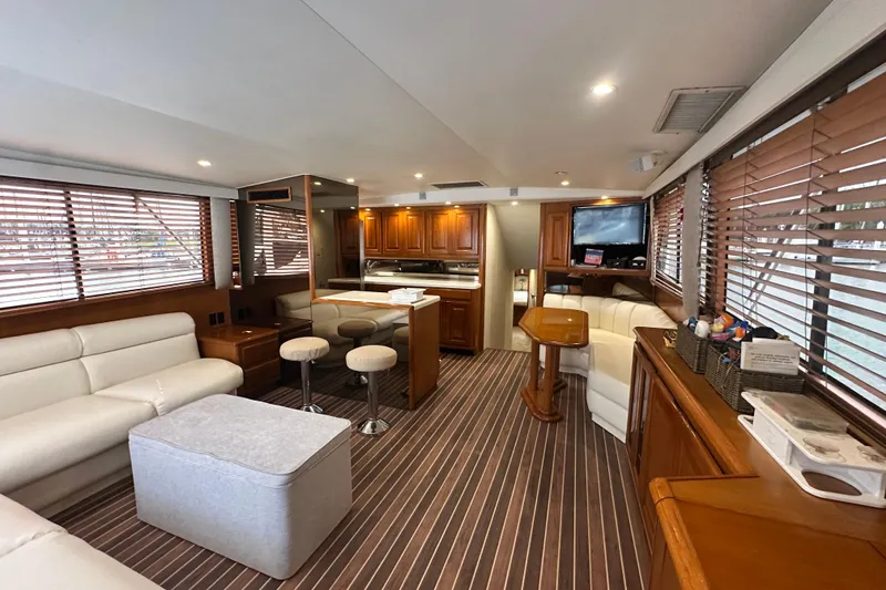 Slide: The Image of Luxurious interior of a 1997 Viking 58 Convertible yacht with elegant wood finishes. - 58
