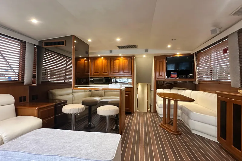 Slide: The Image of Luxurious interior of a 1997 Viking 58 Convertible yacht with elegant wood finishes. - 68