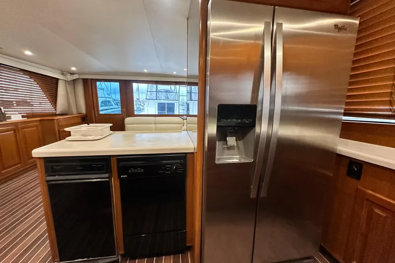 Slide: The Image of Interior of 1997 Viking 58 Convertible yacht with modern kitchen appliances. - 84