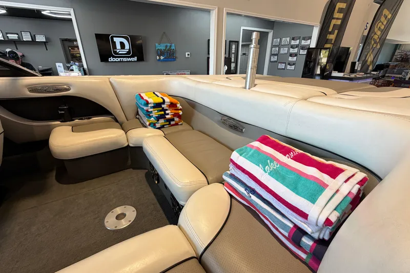 Slide: The Image of Interior of a 2003 Malibu Wakesetter 21 VLX boat with stacked colorful towels. - 11