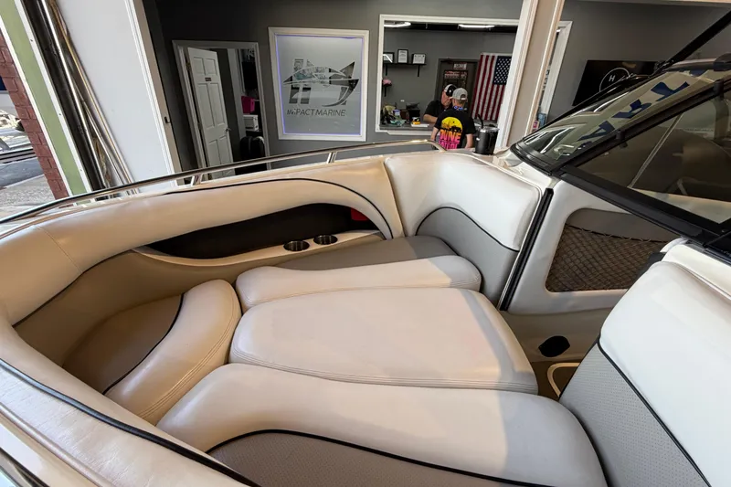 Slide: The Image of Interior of a 2003 Malibu Wakesetter 21 VLX boat with white seating. - 12
