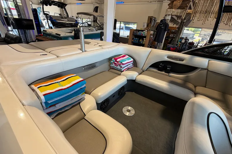 Slide: The Image of Interior of a 2003 Malibu Wakesetter 21 VLX boat with stacked colorful towels. - 9
