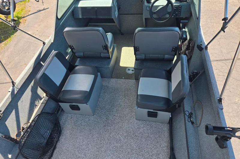 Slide: The Image of 2016 Alumaweld Talon 16 interior with four seats and steering wheel, showcasing spacious layout. - 4