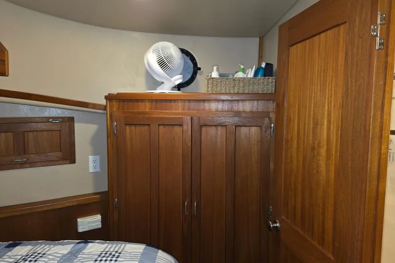 Slide: The Image of Cozy cabin interior of 2006 American Tug 34 Pilothouse Trawler with wooden cabinetry. - 14