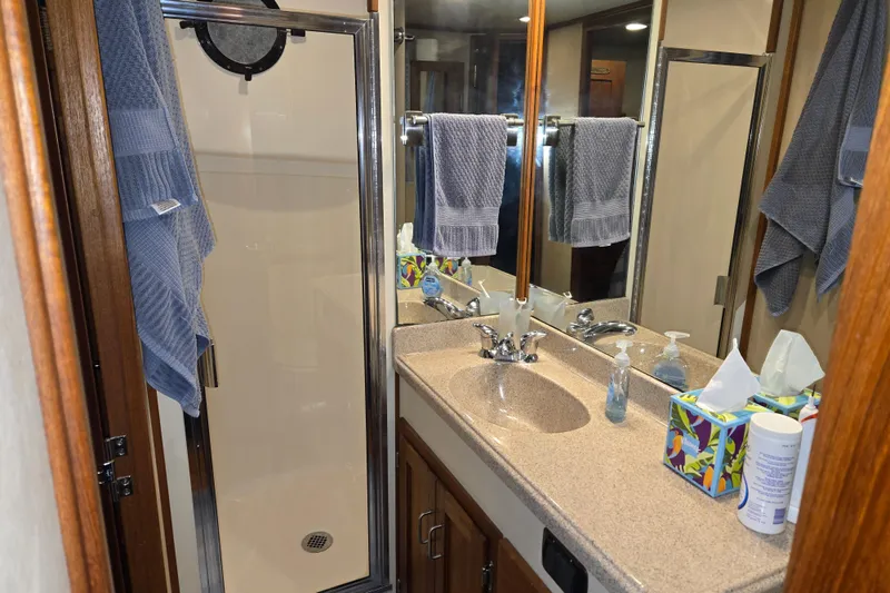 Slide: The Image of Bathroom in 2006 American Tug 34 Pilothouse Trawler with shower, sink, and mirror. - 15