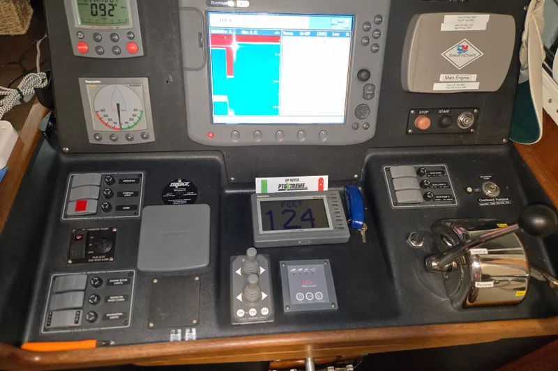 Slide: The Image of Control panel of a 2006 American Tug 34 Pilothouse Trawler with navigation instruments. - 30