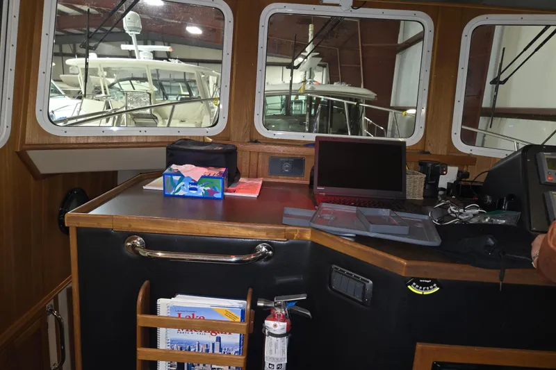 Slide: The Image of Pilothouse interior of 2006 American Tug 34 Pilothouse Trawler with navigation equipment. - 31