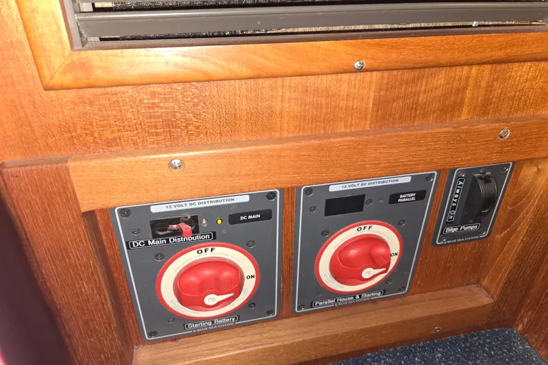 Slide: The Image of Control panel of a 2006 American Tug 34 Pilothouse Trawler with DC distribution switches. - 36