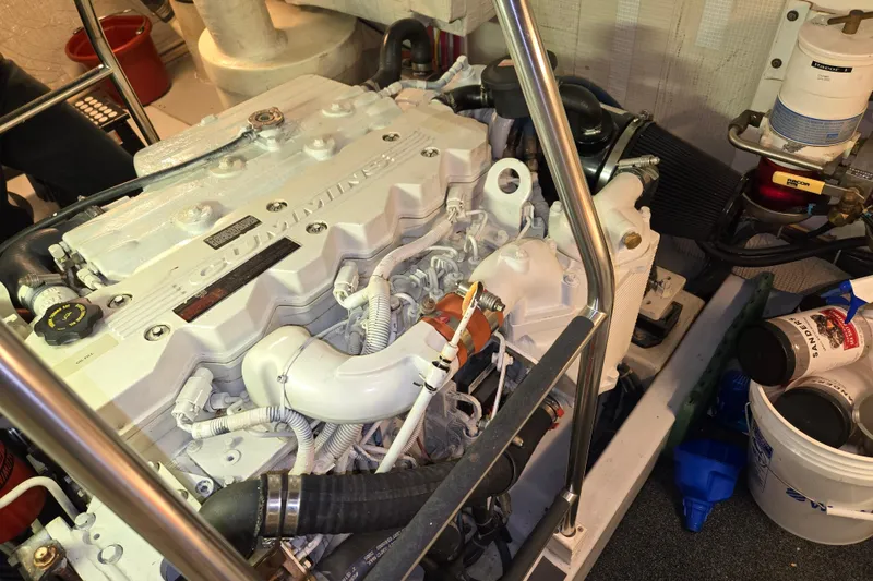 Slide: The Image of Engine room of a 2006 American Tug 34 Pilothouse Trawler, featuring a Cummins engine. - 37