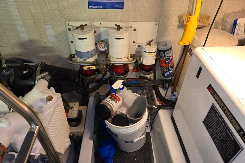 Slide: The Image of Engine room of 2006 American Tug 34 Pilothouse Trawler with filters and maintenance tools. - 38