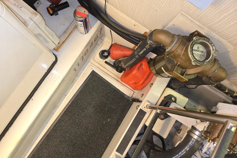 Slide: The Image of Engine room of 2006 American Tug 34 Pilothouse Trawler with mechanical components and tools. - 40