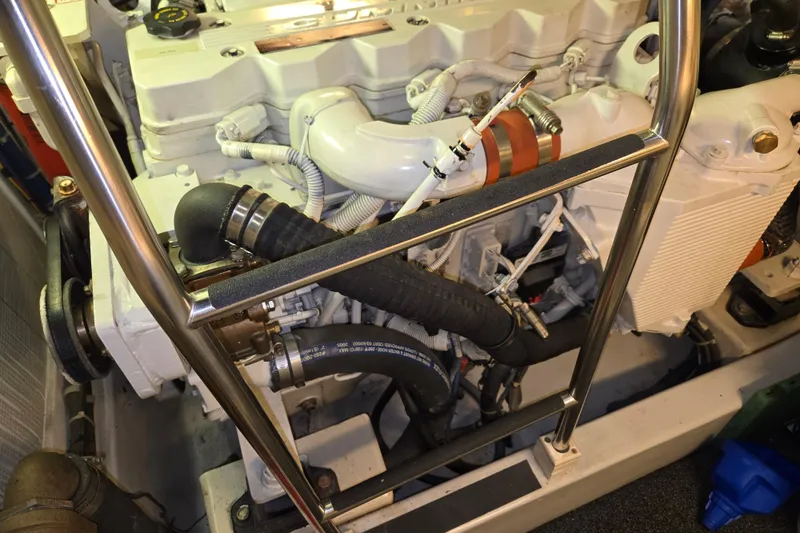 Slide: The Image of Engine room of 2006 American Tug 34 Pilothouse Trawler, showcasing detailed mechanical components. - 42