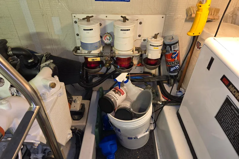 Slide: The Image of Engine room of 2006 American Tug 34 Pilothouse Trawler with filters and maintenance supplies. - 43
