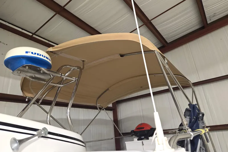 Slide: The Image of 2006 American Tug 34 Pilothouse Trawler with radar and canopy in storage. - 46