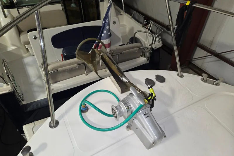 Slide: The Image of 2006 American Tug 34 Pilothouse Trawler deck with anchor and American flag. - 48