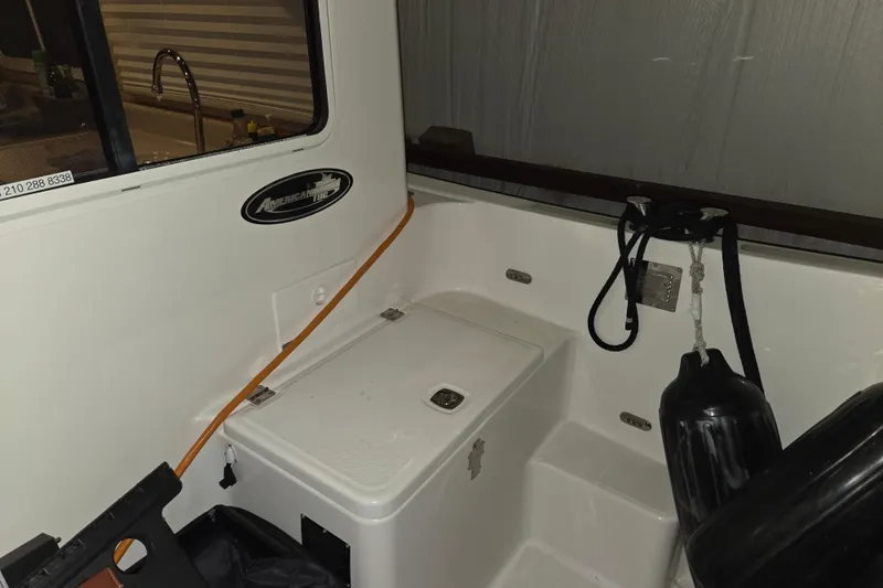 Slide: The Image of 2006 American Tug 34 Pilothouse Trawler interior with storage compartment and equipment. - 50