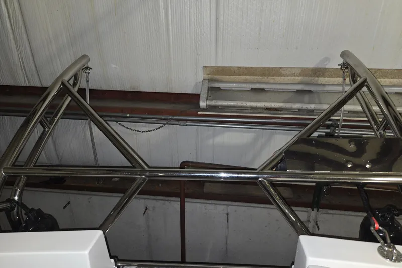 Slide: The Image of Stainless steel framework on a 2006 American Tug 34 Pilothouse Trawler in a storage facility. - 52