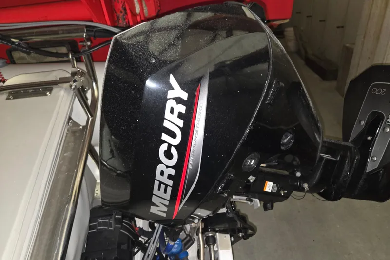 Slide: The Image of Mercury outboard motor on a 2006 American Tug 34 Pilothouse Trawler. - 55