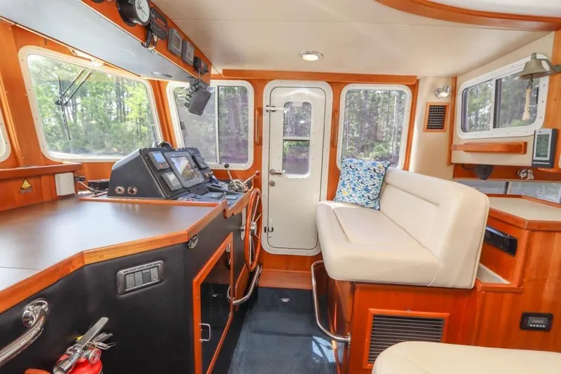 Slide: The Image of Pilothouse interior of 2006 American Tug 34 Pilothouse Trawler with navigation equipment and seating. - 7