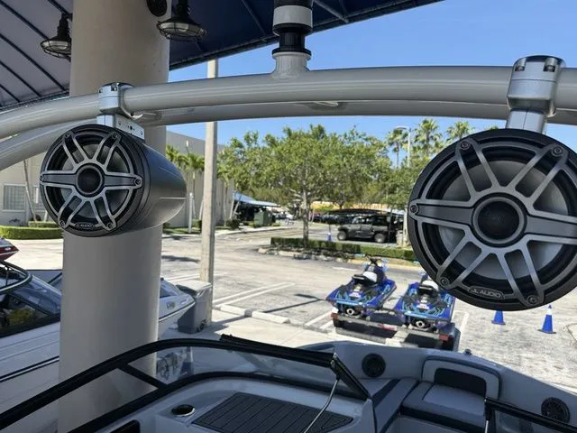 Slide: The Image of Speakers on Yamaha Boats 195S, 2023 model, parked outdoors. - 14