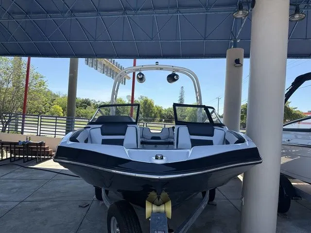Slide: The Image of 2023 Yamaha Boats 195S displayed under a covered area. - 22