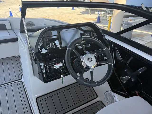 Slide: The Image of Interior view of 2023 Yamaha Boats 195S cockpit with controls. - 8