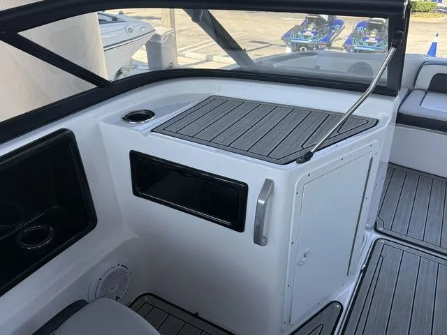 Slide: The Image of Interior of a 2023 Yamaha Boats 195S with modern features. - 9