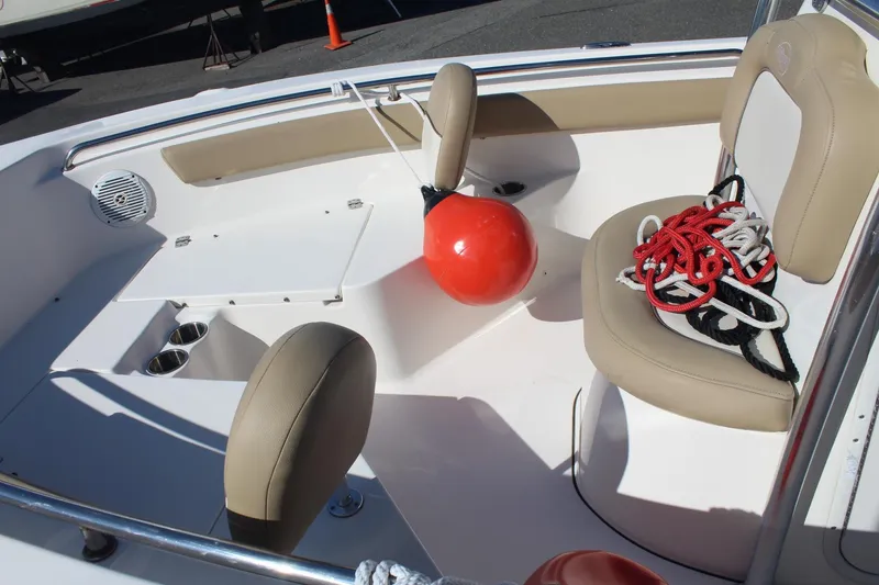 Slide: The Image of 2017 Key West 203 FS boat interior with seating, ropes, and a red buoy. - 10