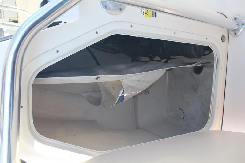 Slide: The Image of Open storage compartment in a 2017 Key West 203 FS boat. - 11