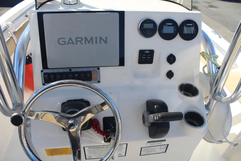 Slide: The Image of 2017 Key West 203 FS boat dashboard with Garmin navigation system and controls. - 13
