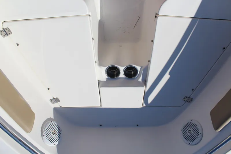 Slide: The Image of 2017 Key West 203 FS boat interior with storage compartments and speakers. - 15