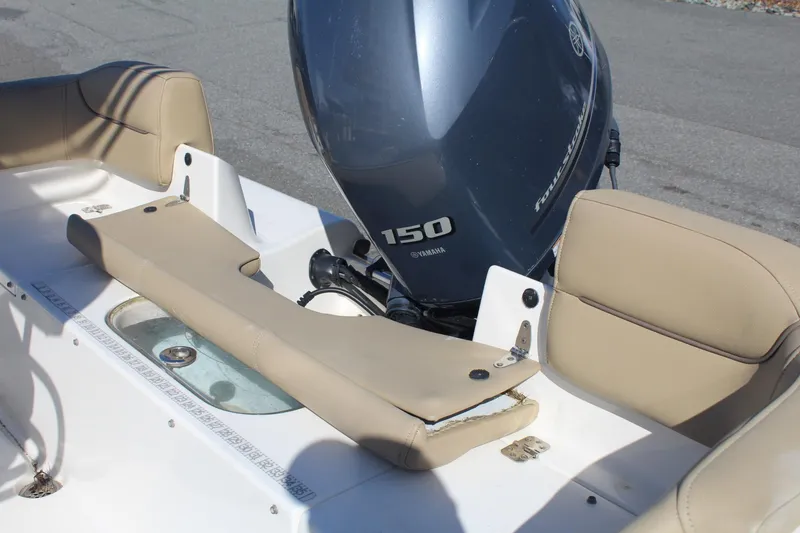 Slide: The Image of 2017 Key West 203 FS boat with Yamaha 150 engine, featuring beige seating. - 16