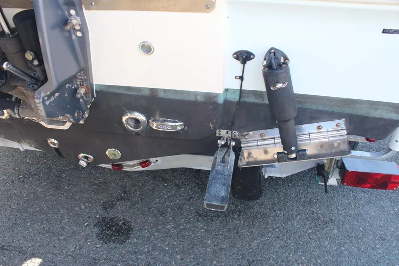 Slide: The Image of Rear view of a 2017 Key West 203 FS boat showing trim tabs and outboard motor mount. - 3