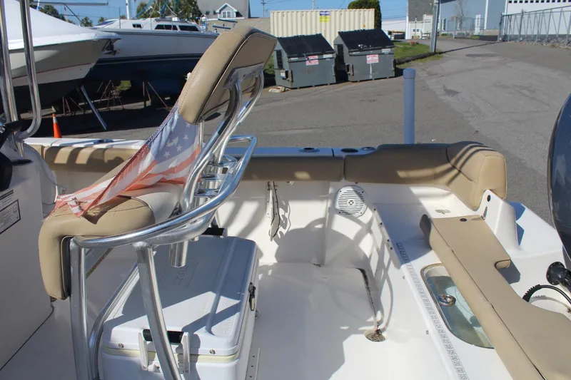 Slide: The Image of 2017 Key West 203 FS boat interior with seating and American flag detail. - 8