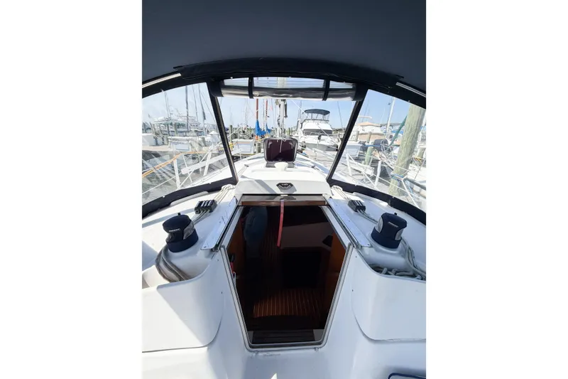 Slide: The Image of Cockpit view of a 2005 Hunter 36 sailboat docked at a marina. - 13