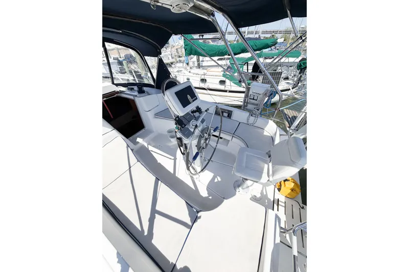 Slide: The Image of Cockpit of a 2005 Hunter 36 sailboat with steering wheel and navigation equipment. - 16