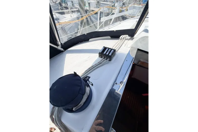Slide: The Image of Deck view of a 2005 Hunter 36 sailboat, featuring rigging and winch. - 20