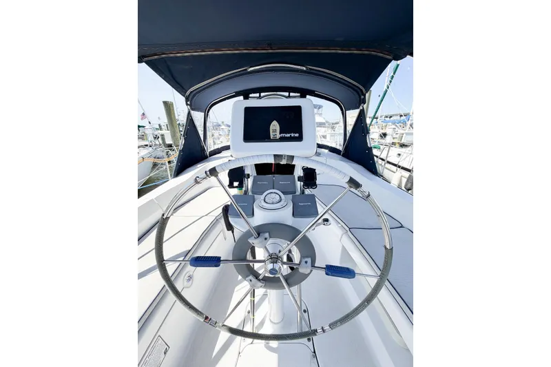 Slide: The Image of Cockpit of 2005 Hunter 36 sailboat with steering wheel and navigation equipment. - 21